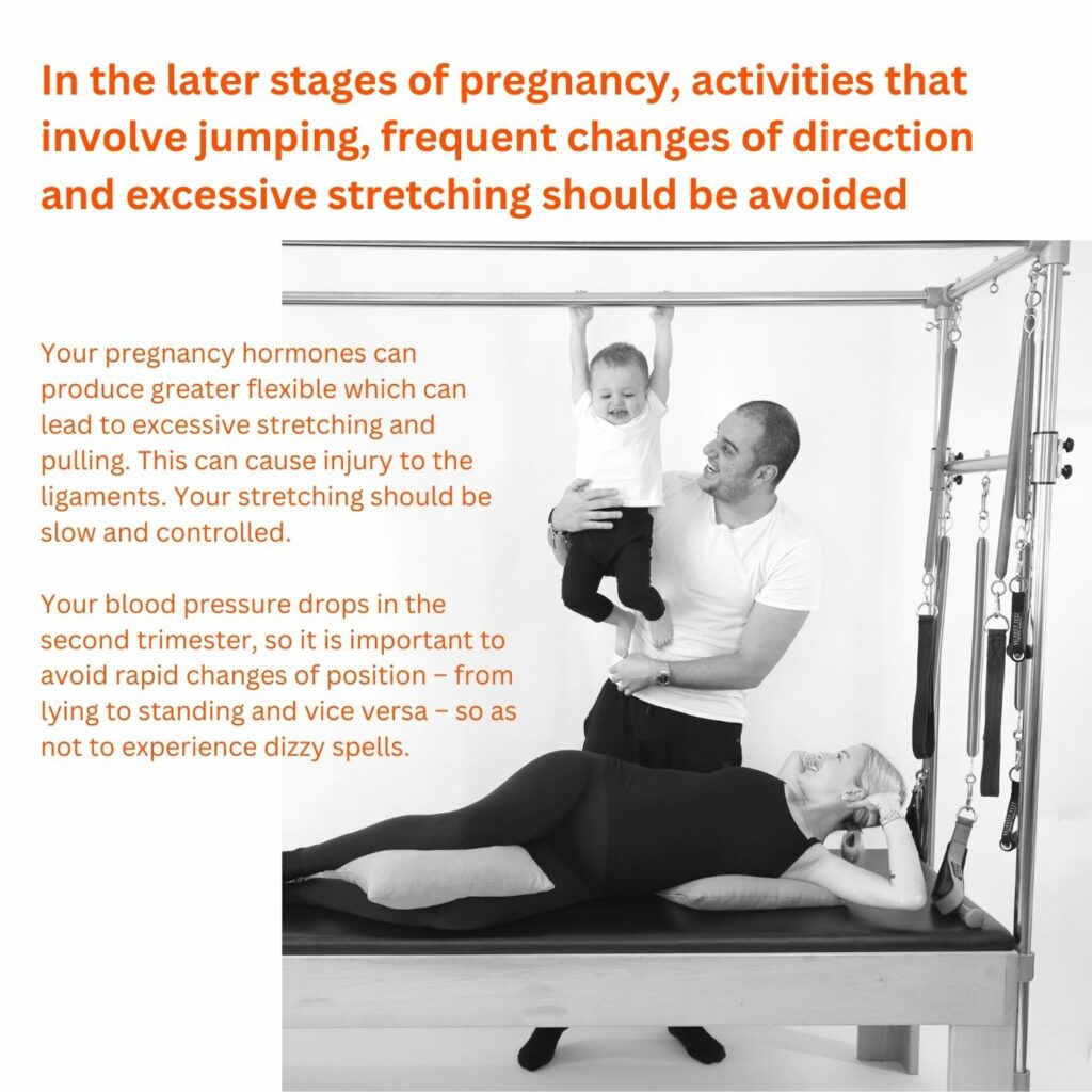 Pregnancy woman exercising on the Pilates Cadillac with her husband and son behind